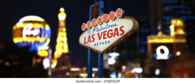 Welcome to Fabulous Las Vegas Neon Sign. Intentional Blurred Las Vegas Strip In Background