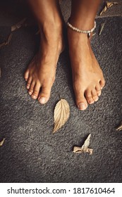 Welcome Fall Background. Closeup Concept Photo Of A Barefoot Women Feet And Dry Leaves. Autumn Season Theme.
