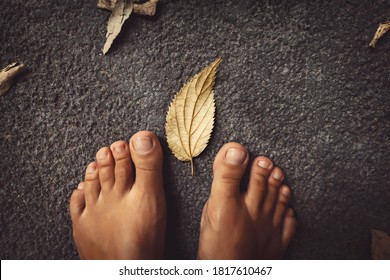 Welcome Fall Background. Closeup Concept Photo Of A Barefoot Women Feet And Dry Leaves. Autumn Season Theme.
