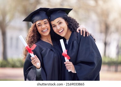 Welcome to the first day of your future. Shot of two young women hugging on graduation day.