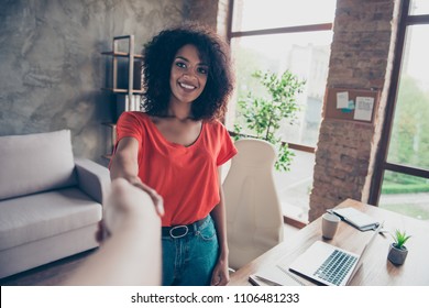 Welcome! First person view portrait pf friendly cute woman with beaming smile making hands shake with colleague having business meeting sign up successful contract in modern office - Shutterstock ID 1106481233