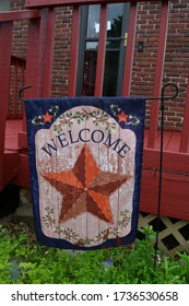 Welcome Garden Flag By The Deck Of A House