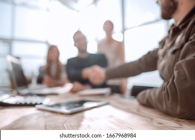 welcome handshake of business partners in the office - Shutterstock ID 1667968984