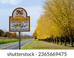 Welcome to Maryland sign with yellow trees