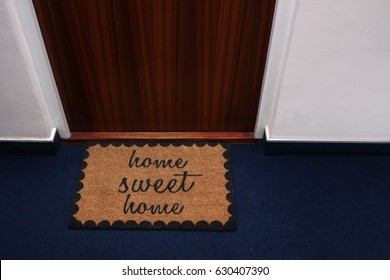 A welcome mat with the message Home Sweet Home depicted on it