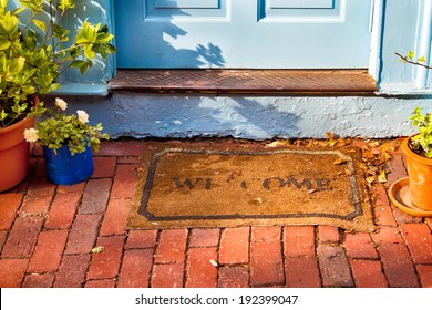 Welcome Mat Outside A Cottage Front Door. 