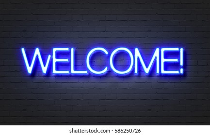 Welcome Neon Sign On Brick Wall Background