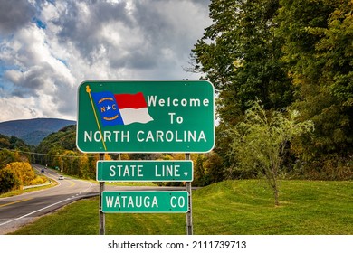 A Welcome to North Carolina sign on the highway marking the state border with Tennessee. - Shutterstock ID 2111739713