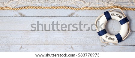 Welcome on Board - lifebuoy with text on horizontal wooden background texture, copy space for individual text