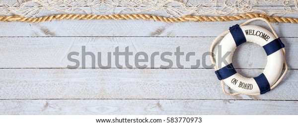 Welcome on Board\
- lifebuoy with text on horizontal wooden background texture, copy\
space for individual\
text