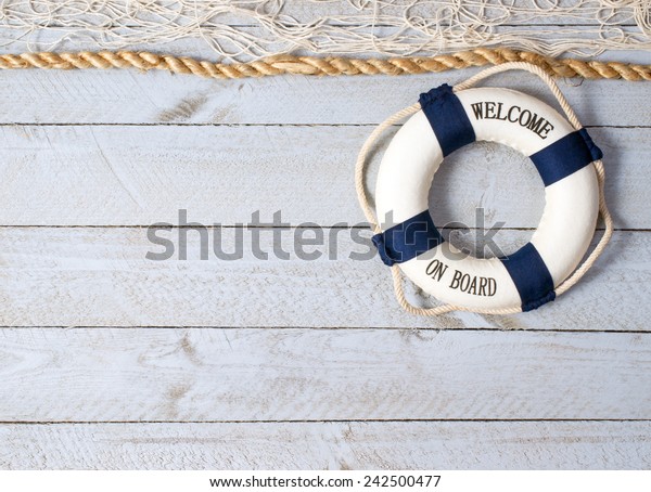 Welcome on Board - lifebuoy on wooden\
background and copy space for individual\
text