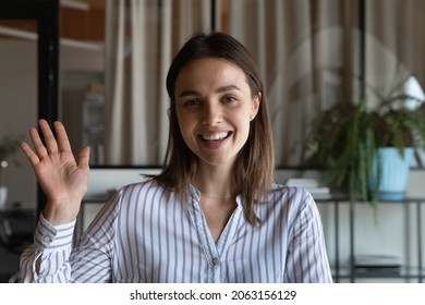 Welcome On Business Channel. Screen Portrait Of Smiling Female Presenter Speaker Expert Wave Hand To Camera Record Vlog Or Training. Pleasant Young Woman Employee Greet Dialogue Partner By Video Call