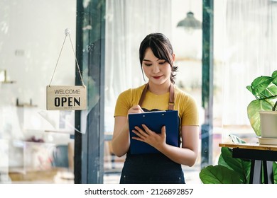 Welcome open shop barista waitress open sign on glass door modern coffee shop ready to serve restaurant cafe retail small business owners. - Powered by Shutterstock