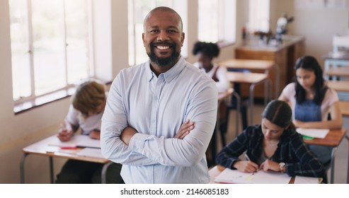 Welcome To Our World Of Learning. Portrait Of Mature Man Teaching A Class Of Teenage Students.