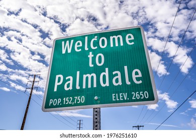 Welcome To Palmdale Green City Sign with Population Blue Sky with Power Lines and Clouds