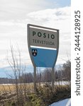 Welcome to Posio (Posio Tervetuloa) sign on the side of the road in spring, Posio, Lapland, Finland.
