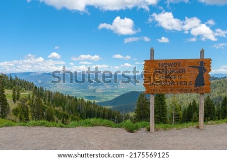 Welcome posted of Jackson hole viewpoint looking down to the valley with the Tetons mountains Wyoming state. 