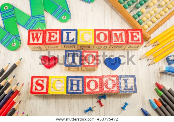 Welcome to school written with wooden cubicle letters