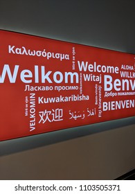 Welcome Sign In Bologna Airport, In Different Languages (translation: Welcome All).