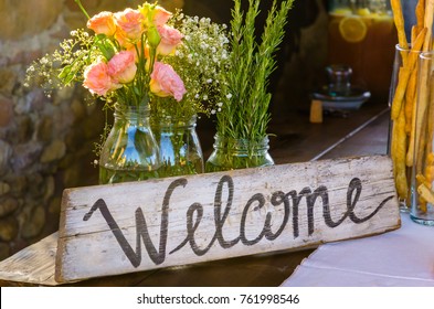 Welcome sign painted on wood 
