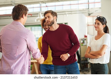 Welcome to the team. Shot of a businesspeople shaking hands in an office. - Powered by Shutterstock