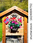 Welcome (Velkommen) sign with flowers design decoration house entrance cozy scandinavian exterior