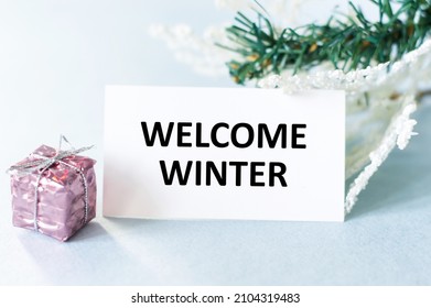 Welcome Winter Text Card On A Light Background Next To The Gift In The Package