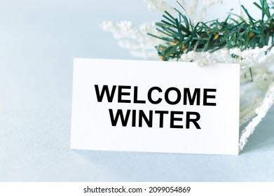 Welcome Winter Text On A Card On A Light Background Next To Spruce Branches, Festive Background