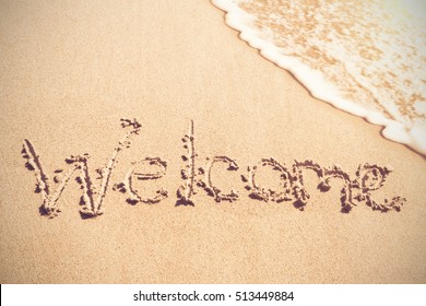 Welcome Written On Sand At Beach