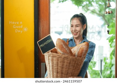 Welcoming Asian bakery staff with a basket full of fresh bread, exemplifying small business charm. happiness of opening a coffee shop in the morning small family business
 - Powered by Shutterstock