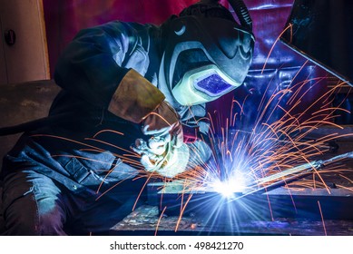 welder, craftsman, erecting technical steel Industrial steel welder in factory