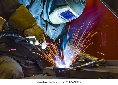 welder, craftsman, erecting technical steel Industrial steel welder in factory