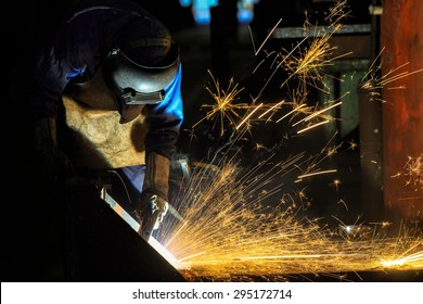 Welder is cutting steel frame by carbon air arc gouging