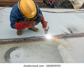 The Welder Is Gouging Back Weld Of The Steel Plate.