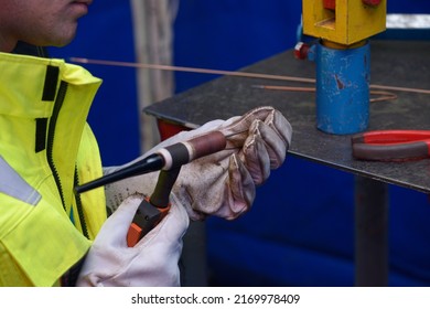 Welder Hands Preparing An Argon Torch For Argon Welding, Workshop