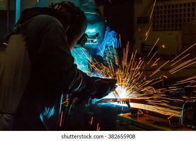 welder Industrial automotive part in factory - Shutterstock ID 382655908