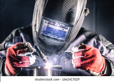 Welder industrial worker welding with argon machine. - Powered by Shutterstock