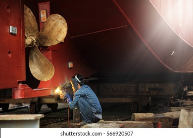 Welder Man Working In Ship Yard,color Toned.