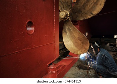 Welder Man Working In Ship Yard,color Toned.