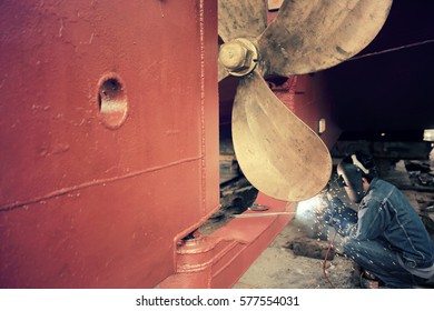 Welder Man Working In Ship Yard,color Toned.