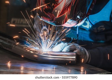 Welder in mask welding metal and sparks metal close. spark, protective, welder, tool, flash, welding, skill, equipment, protection, industrial, safety, metalwork, mask, gloves, sparks welding, sparks