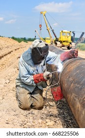 Welder on the pipeline repairs. 