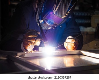 Welder Welding Aluminum Structure In The Workshop