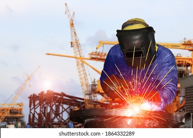 Welder Is Welding Process In Construction Site Background