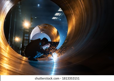 The welder is welding steel plates - Shutterstock ID 1813353151