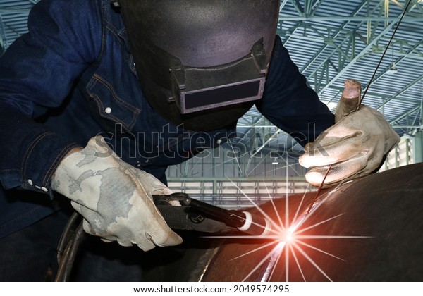 Welder is\
welding Tungsten inert Gas welding, Tig weld for making new pipe in\
manufacturer workshop, TIG Welding\
torch