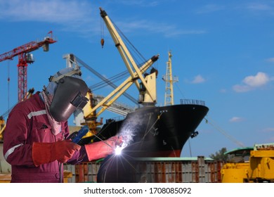 Welding Arc Worker With Spark Weld Factory At Shipbuilding And Ship Repairing Industrial, Wear Equipment Protective For Safety.