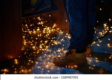 Welding Arcs And Sparks Falling Down In Darkness