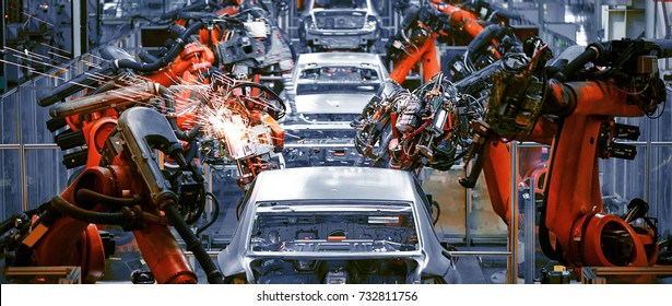 The welding arm on the automobile production line is being welded - Shutterstock ID 732811756