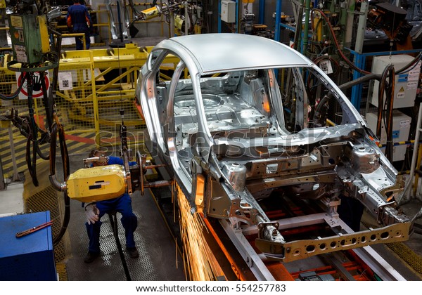 Welding of car\
body in assembly shop at a\
factory